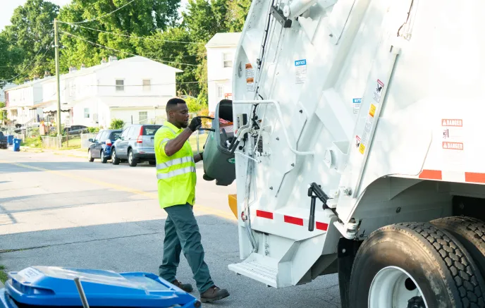 Sanitation Worker Collecting Trash