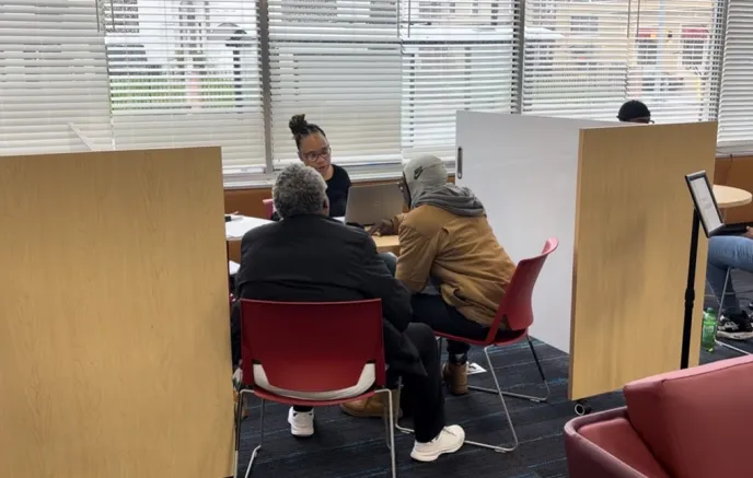 people getting help in an office