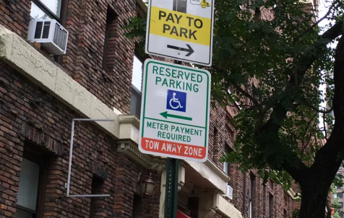 Parking sign with a handicap symbol 