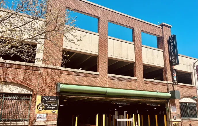 outside of a parking garage on West Street