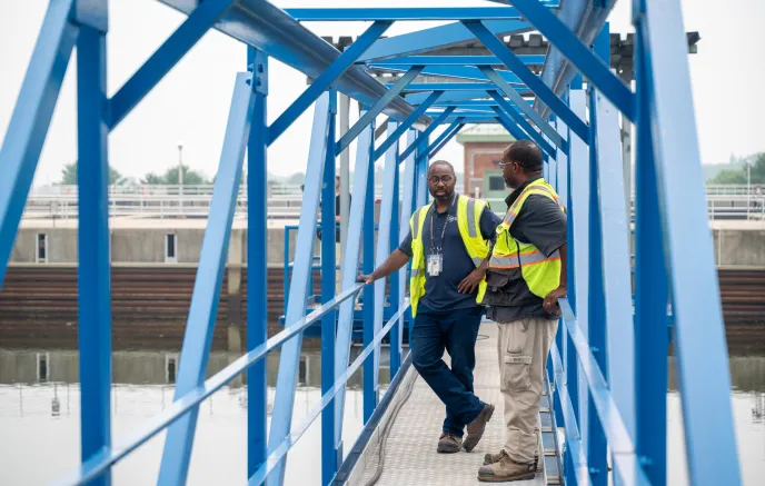 Two men standing on a water bridge