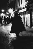 Person Wearing Cape at Night by Jim McKinniss