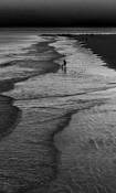 Sunset Surf Walk by Gerald Shonkwiler