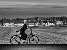 Amish Girl on Bike by William R. West, Jr.