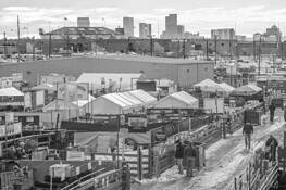 Stockyards and Denver Skyline by James Esten