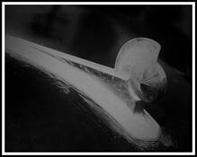 Hood Ornament by Ron Discipulo