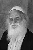 Man Sitting Near Kotel by Bob Neiman