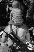 Father and Son at Open Carry Rally-Alamo Plaza by Bruce Barshop
