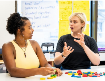 Two educators exploring pattern blocks