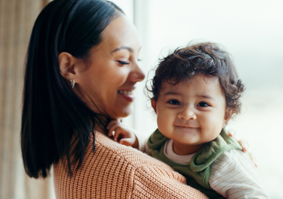 Adult and toddler smiling
