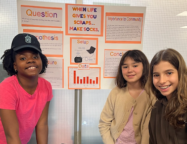 School for Children students with a poster of their project at the annual Science Expo (2026)