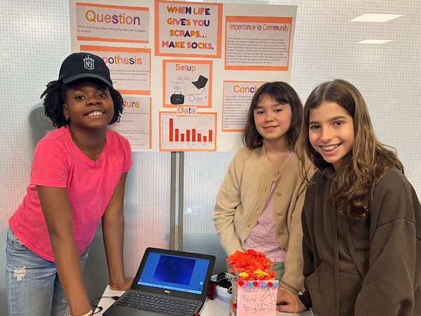 School for Children students with a poster of their project at the annual Science Expo (2026)