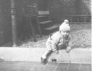 Archival image of young child outside