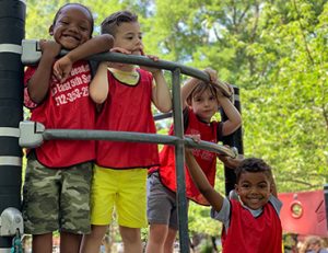 Four Head Start students on the playground