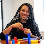 Educator smiles during professional development workshop