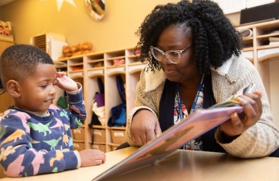 Child and teacher reading