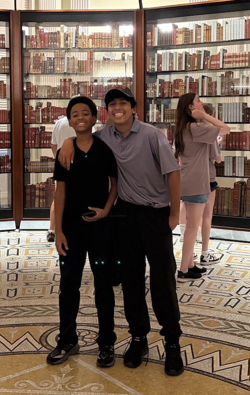 Two eighth grade students smiling together inside the Library of Congress