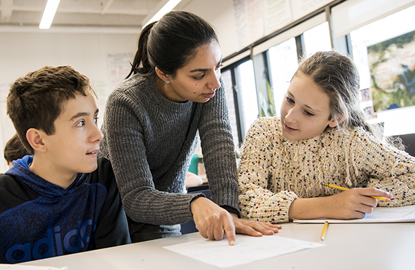 Student teachers work with students for hands-on teacher training