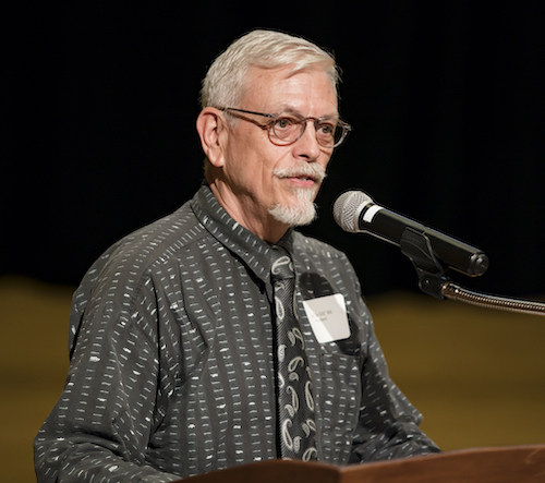 Jim Clay speaking at podium