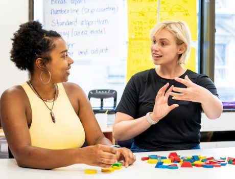 Two grad students doing a math activity