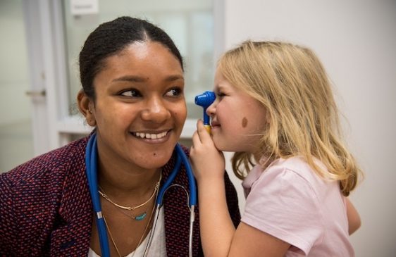 Child Life grad student works with child
