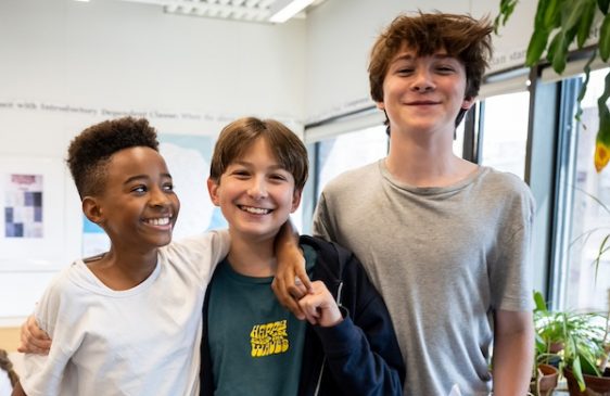 Three children smiling