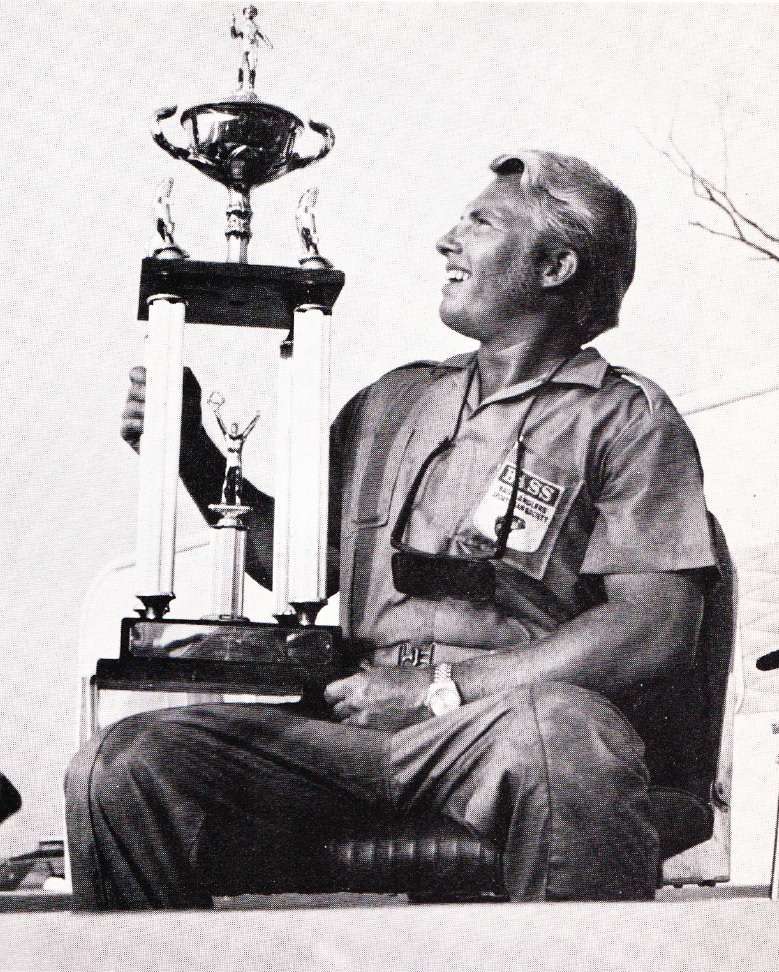 Roland Martin Ross Barnet Win. Nov-Dec 1971 Bass Master Mag Roland Martin admires his 1st-place trophy for his win at the Ross Barnett All-American tournament. The win not only got him some new bling but also his first AOY award. Photo Nov/Dec 1971 issue of Bass Master Magazine.