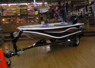 QuinTrex 371 Treasure bass boat as sold by Popeye's. Photo Terry Battisti circa 2006.