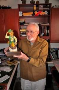 Stan Fagerstrom holding a figurine that was given to him by Ray Scott at the first Bassmaster Classic held at Lake Mead, NV. Photo Terry Battisti.