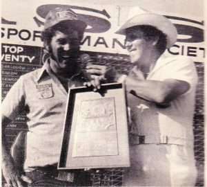 Rick Garlough discusses his win at Bull Shoals as Ray Scott presents his trophy. Photo February 1977 issue of Bassmaster Magazine.