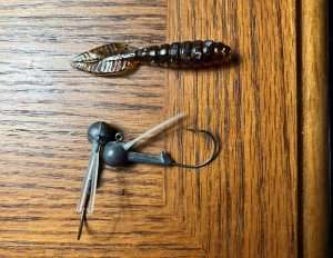 Bass Fishing Archives reader and supporter Dave Garner sent in this picture of a Cotton Cordell 3-inch Feathertail Grub for us to post. Included was the head he preferred to use, a 3/8-oz ball head made from a muzzelloader round with an extended shoulder. Thank you Dave for contributing to the Bass Fishing Archives!