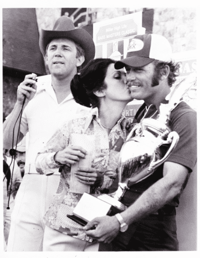 1974 Bass Masters Classic, Wheeler Lake. Tommy Martin and his wife celebrate the Classic 4 win as Ray Scott announces. Photo Stan Fagerstrom.