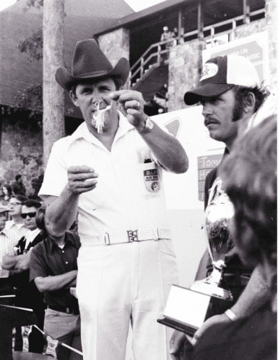 1974 Bass Masters Classic Wheeler Lake. Ray Scott shows the Fleck Weed Whacker Spinnerbait that Tommy Martin used to win Classic 4. Photo Stan Fagerstrom.
