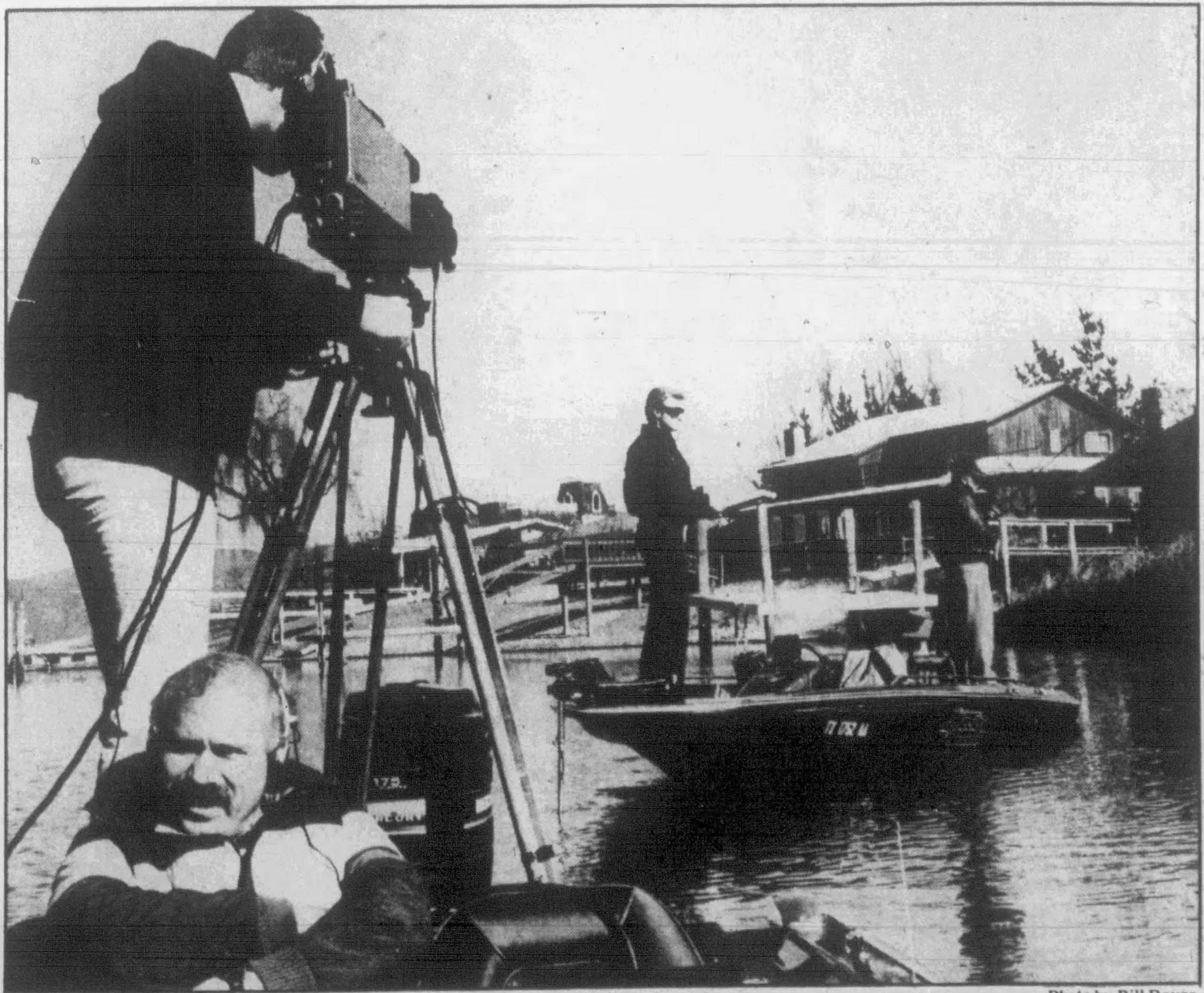 Original Title and Caption: "Oroville's top angler catches for the cameras - BASSMASTERS film crew waits for Gary Klein, left, and Chuck Roberts to get a strike." January 1987, Oroville Mercury Register, photo by Bill Royer.