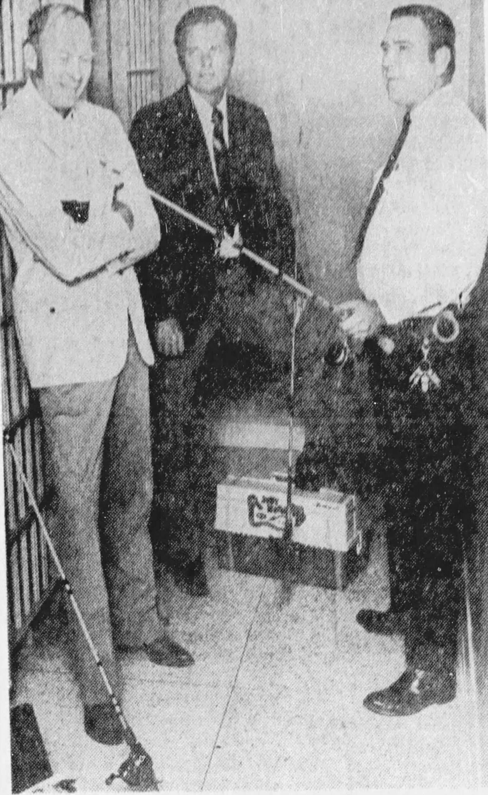 Wood-Honeycutt_Oct_1972 Original Caption: TWO OF THE NATION'S top 24 bass fishermen - Forrest Wood (left) of Flippin, Ark., abd Blake Honeycutt (center) of Hickory, N.C., who possibly could get some inside information on the mystery lake which will host the Bassmasters Classic this week, were placed under security on their arrival in Memphis. Lt. Mike York, president of the Lawmen's Bass Club, heads the security detachment. October 1972, The Commercial Appeal (Memphis, TN), photo credit: Staff photo.