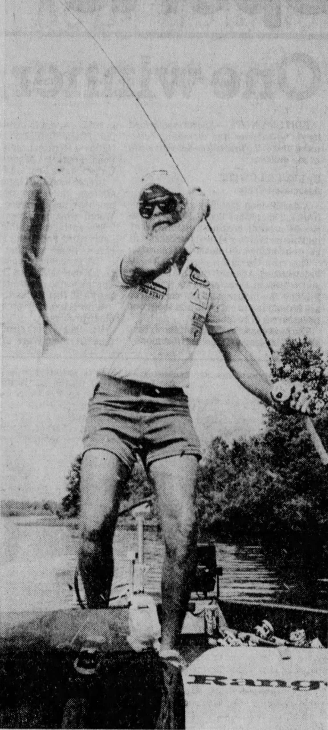Fenton__Aug__1985 Original Caption: David Fenton of Conroe hauls in a keeper during recent BASS Classic on the Arkansas River. August 1985, photo credit: Star-Telegram