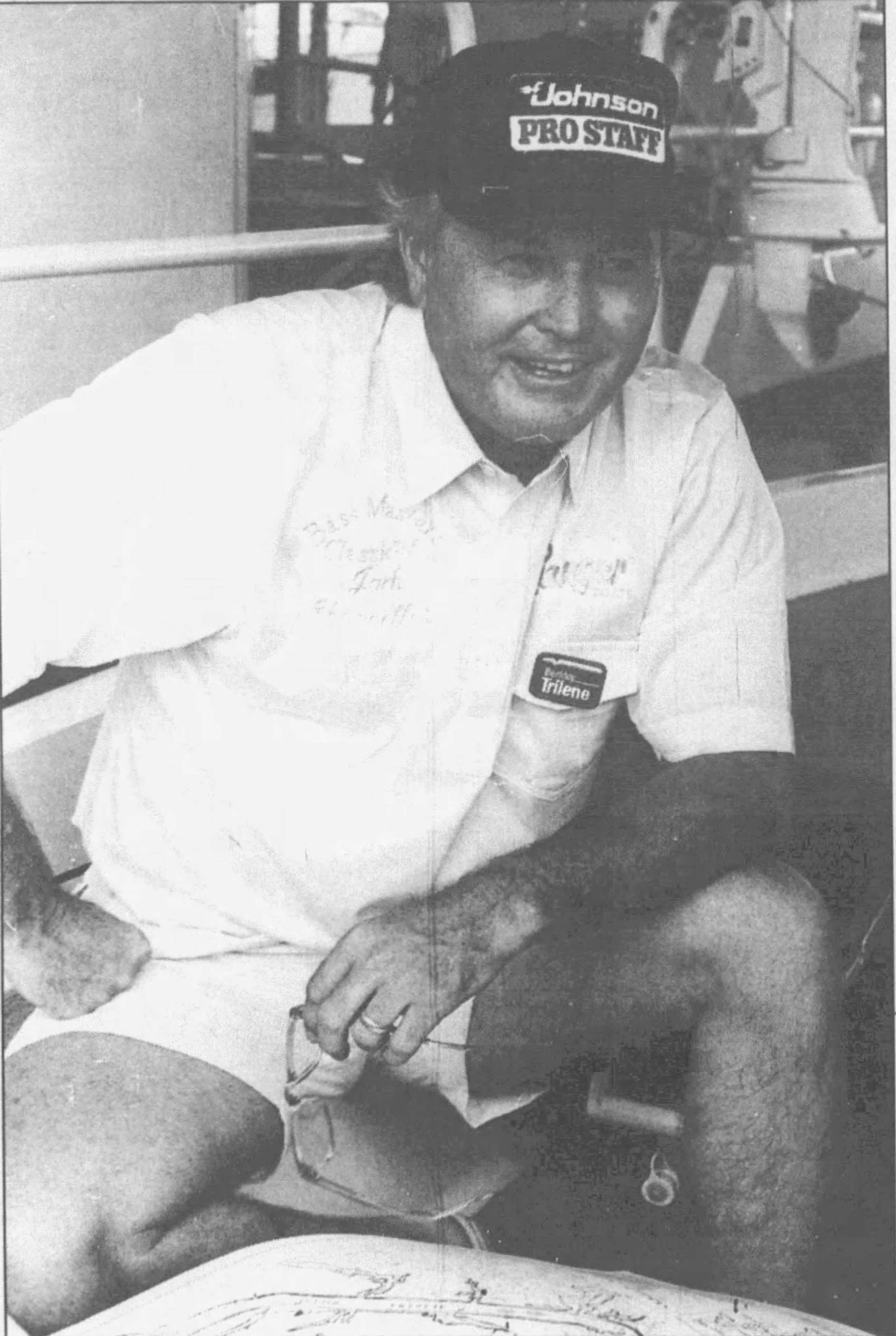 Chancellor__Jul__1990 compressed Original Caption: Jack Chancellor examines a topographical map of the Alabama River. The Montgomery Advisor, July 1990. photo by Alan Polk.