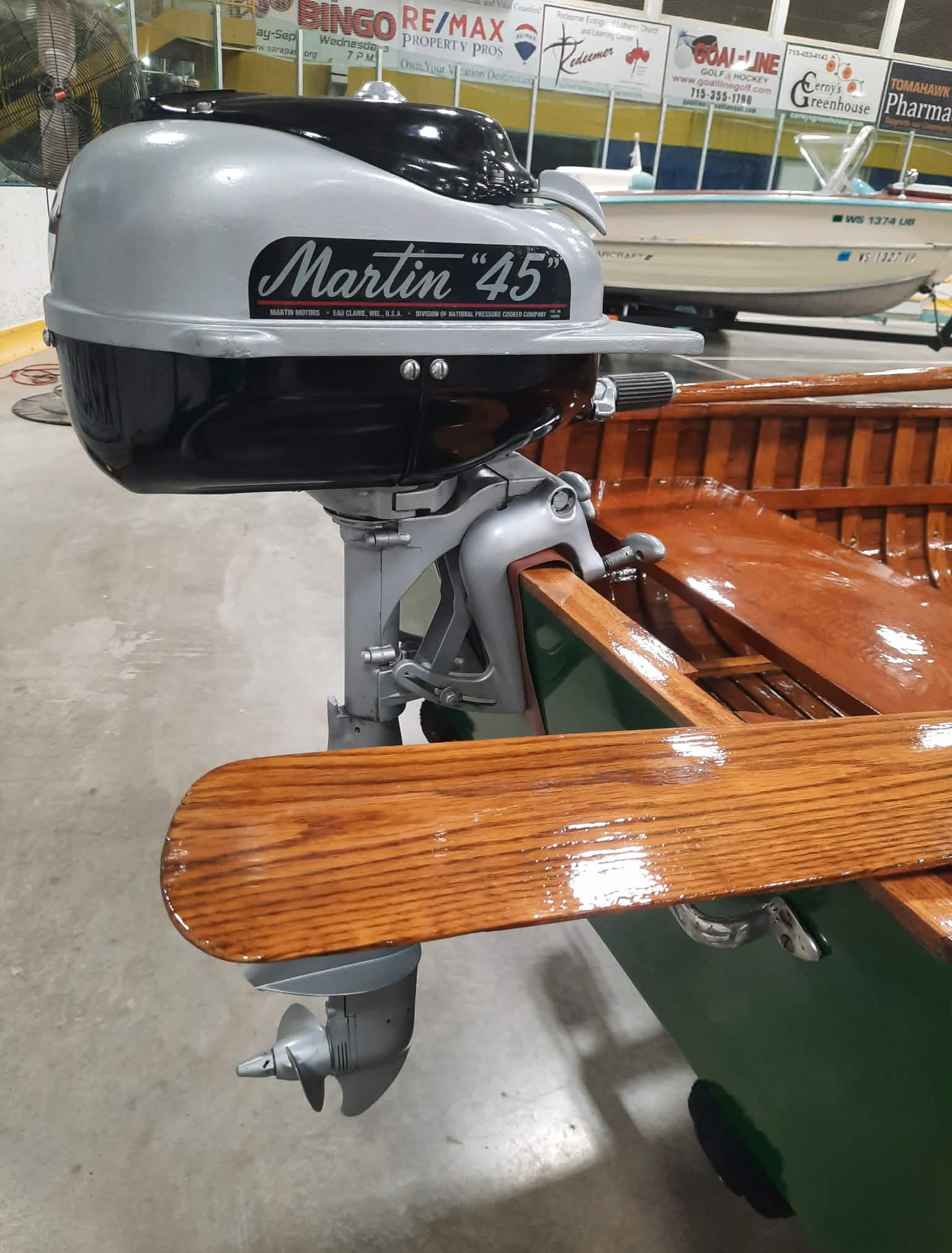 Martin 45, 4.5 hp outboard motor attached to transom of 1948 Shell Lake Snipe model wood boat.