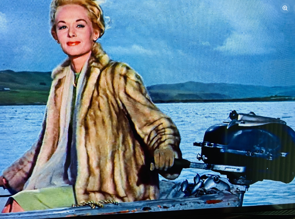 Tippi Hedren in a scene from Alfred Hitchcock's 1963 movie The Birds. She looks to be running a Martin Outboard Engine in this scene.
