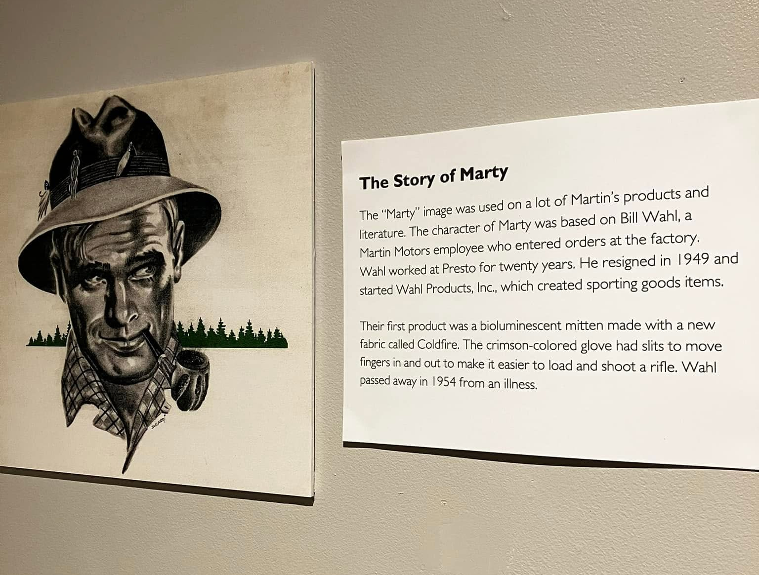 The Story of Marty, the Martin Motors icon and fictional spokesperson. This image is from the Dec. 2024 exhibition of the Martin Motors and memorabilia collection of Dick Theis that was on display at the Chippewa Valley Museum in Eau Claire, Wisconsin. Excellent photos and a video of this exhibition were shared on the "Martin outboard fun page" Facebook group by Josh Lierman. The image of "Marty" - the man wearing a floppy fedora hat and smoking a pipe - appeared on numerous Martin motors and products, literature and other paraphernalia.