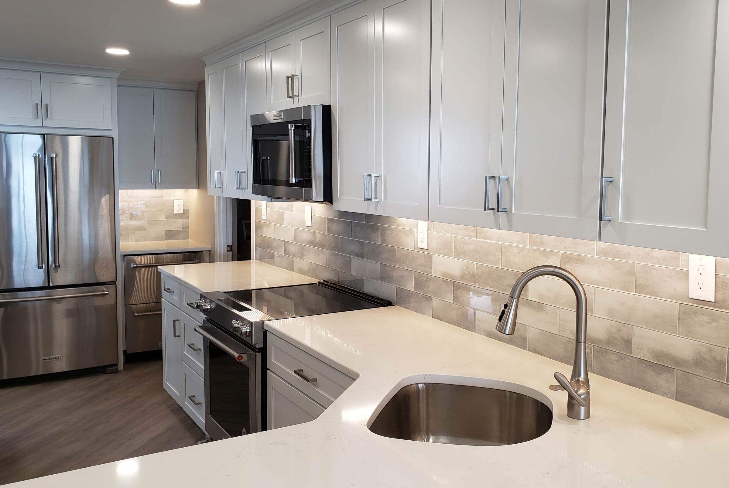 Contemporary Kitchen Remodel by United Custom Contractors Inc project photo