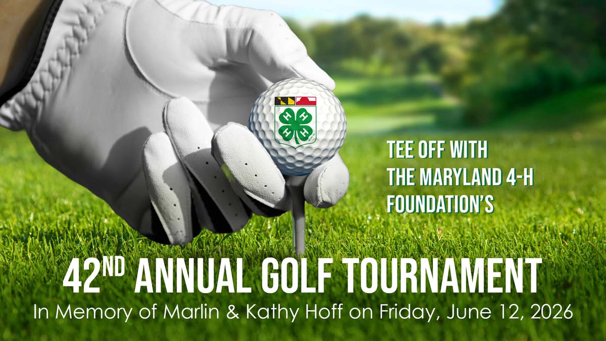 A golfer's hand holding a golf ball on a tee, promoting the 42nd Annual Golf Tournament for the Maryland 4-H Foundation.