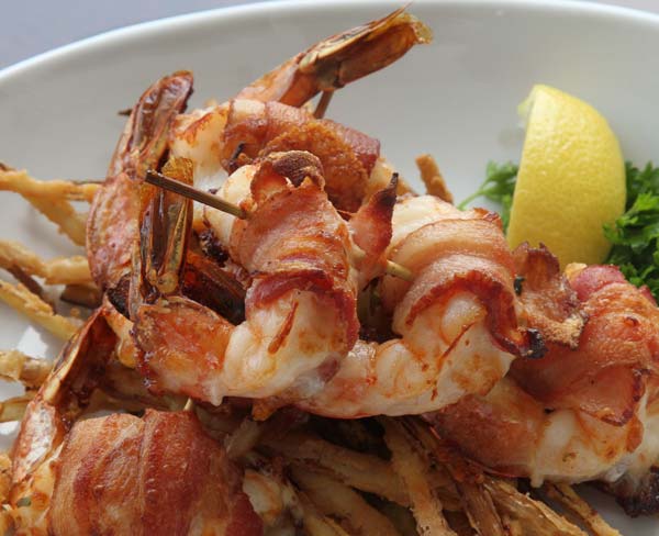 Closeup photo of bacon wrapper shrimp dish