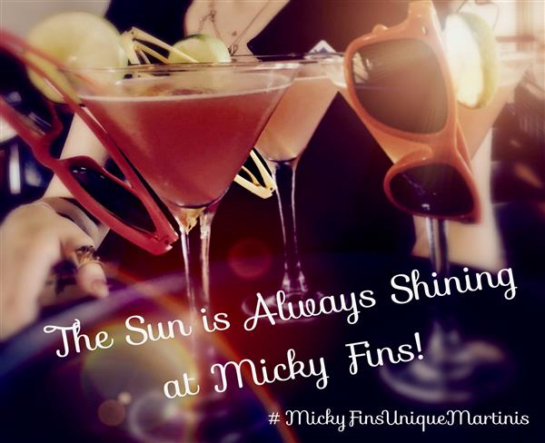 The sun is always shining at Micky Fins text over photo of cocktails