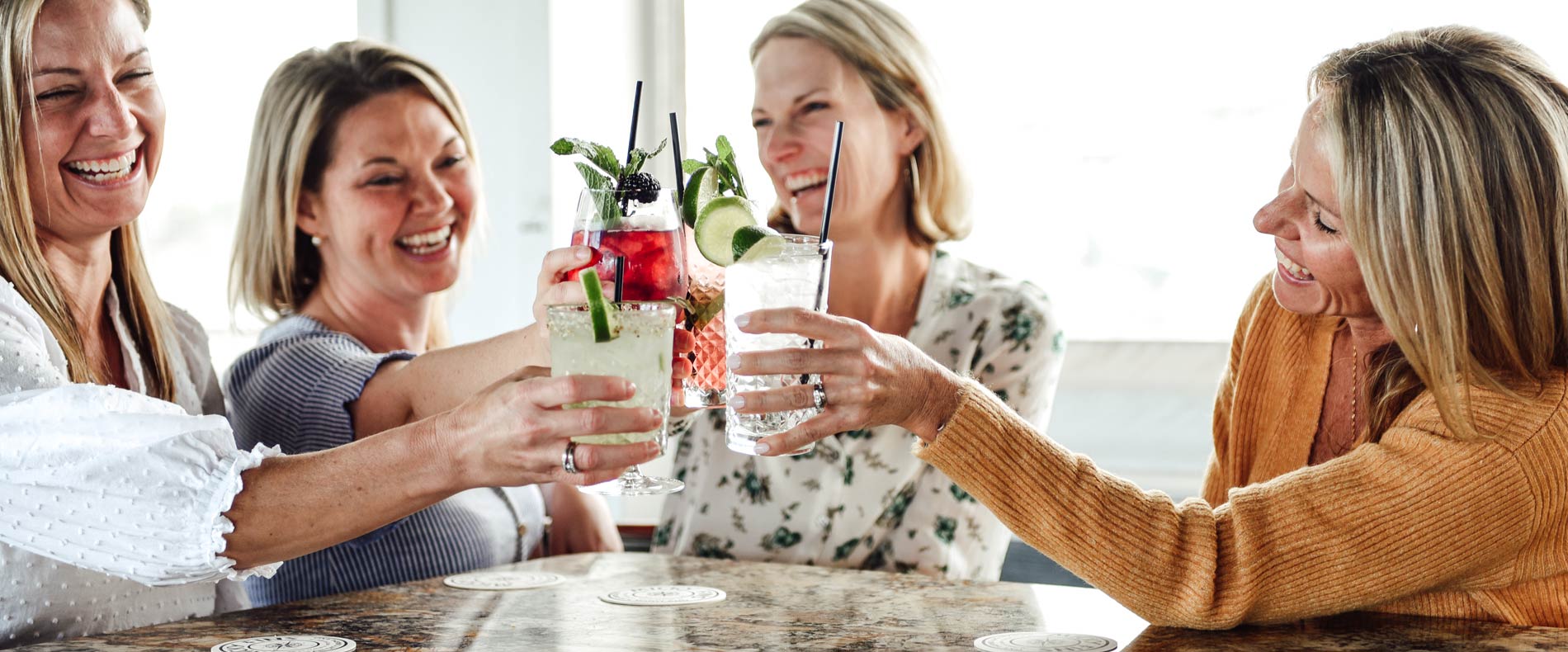 Four ladies having a cocktail