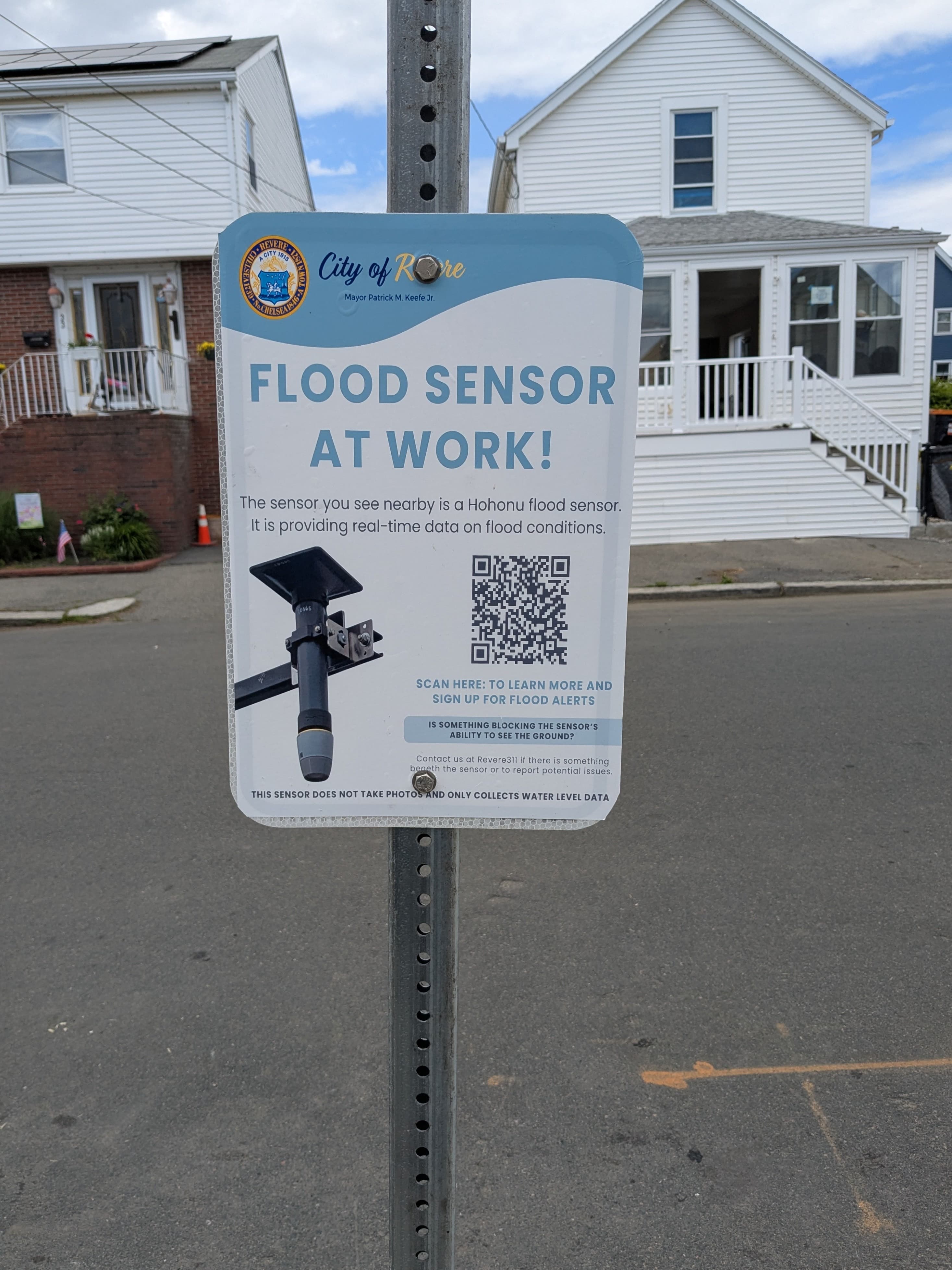 Flood sensor sign on pole