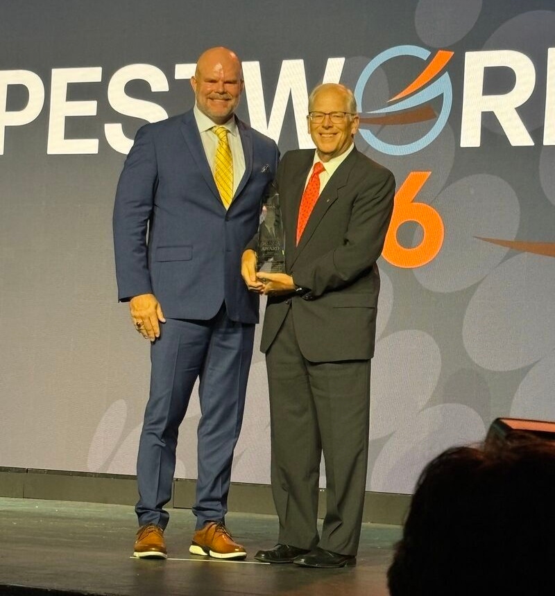 russ ives receives the pinnacle award at Pest World