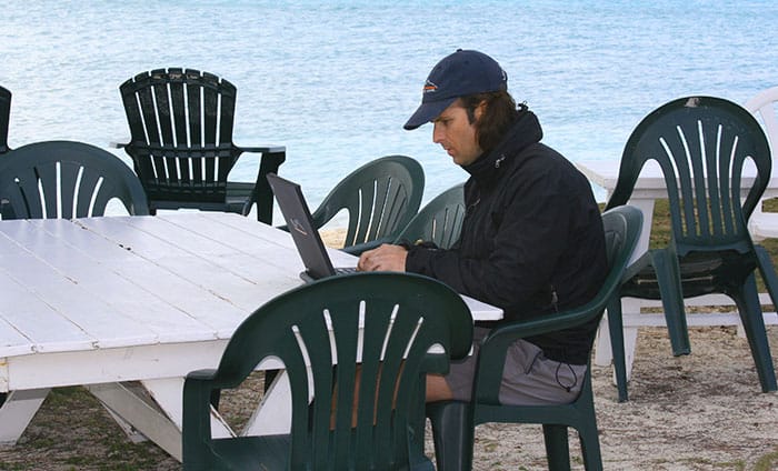 Online business gives you flexible times to work and you can travel anywhere you have an internet connection. Brandon working after a day of fishing in the Bahamas.