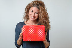 women holding a wrapped box.