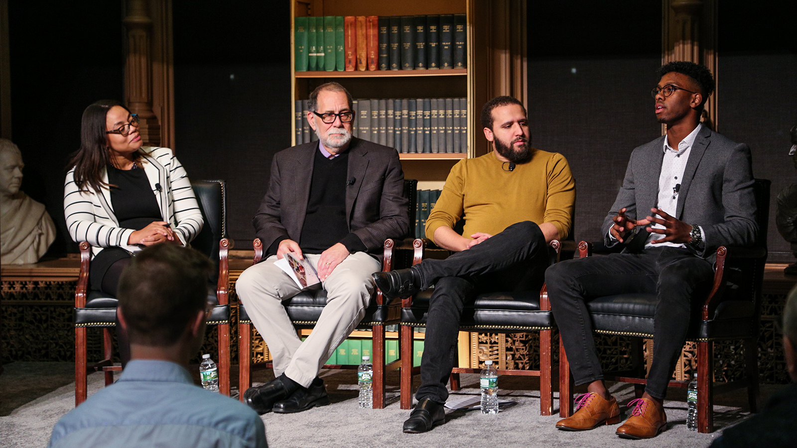 Panel of speakers on stage at "Before Ferguson, Beyond Ferguson" event